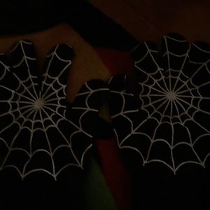 Spider web scarf and spider web gloves.